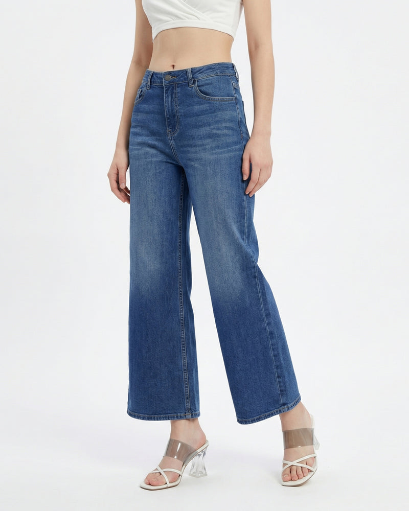 woman wearing high-rise wide-leg blue jeans