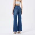 woman wearing high-rise wide-leg blue jeans