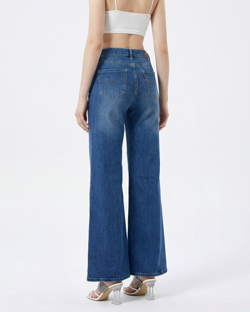 woman wearing high-rise wide-leg blue jeans