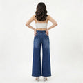 woman wearing high-rise wide-leg blue jeans